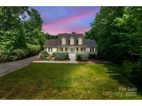 Charming two-story home with a well-manicured lawn, black shutters, and dormer windows at 1184 W Oak Dr, Rock Hill, SC 29732