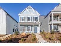 Charming two-story home with a welcoming front porch and beautifully landscaped yard, perfect for relaxation at 1359 Russell St, Rock Hill, SC 29730