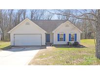 Charming one-story home with blue shutters, a paved driveway, and an attached garage at 1367 Springview Ct, Rock Hill, SC 29732