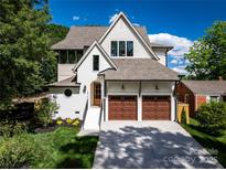 Charming two-story home boasting a well-manicured lawn and a two-car garage at 1816 Parson St, Charlotte, NC 28205