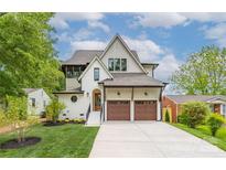 Beautiful two-story home boasting a manicured lawn, two-car garage, and charming architectural details at 1816 Parson St, Charlotte, NC 28205