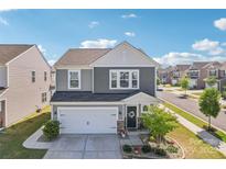 Charming two-story home with a manicured front yard, two car garage and beautiful stone accents at 6878 Spring Peeper Ln, Lancaster, SC 29720