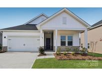 Charming single-Gathering home boasts a manicured lawn and attached two-car garage at 1229 Morehead Dr, Salisbury, NC 28144