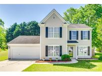 Charming two-story home with a well-manicured lawn, attached garage, and classic curb appeal at 1605 Tate Rd # 258, Rock Hill, SC 29732