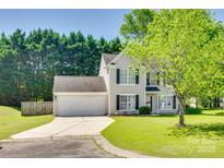Charming two-story home featuring a well-maintained lawn, mature trees, and a two-car garage at 1605 Tate Rd # 258, Rock Hill, SC 29732