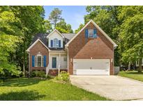 Charming brick home with manicured lawn, two-car garage, and blue shutters at 4790 Cascade Ave, Rock Hill, SC 29732