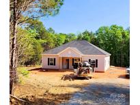 Charming single-story home with a symmetrical facade, dark shutters, and a well-manicured lawn at 1247 Beltline Rd # 1, Chester, SC 29706