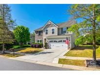 Charming two-story home with well-maintained lawn, driveway and two-car garage at 5070 Saint Clair St, Fort Mill, SC 29715