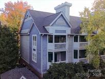 Charming two-story condominium with balconies and professionally landscaped grounds at 525 N Graham St, Charlotte, NC 28202