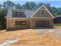 Charming new construction home with a two car garage and inviting front porch at 28770 Hwy 73 Hwy, Albemarle, NC 28001