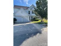 Charming two-story home with a two-car garage and well-maintained front lawn at 3038 Old Ironside Dr, Charlotte, NC 28213