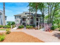 Beautiful lakefront condo with multiple balconies and lush landscaping at 803 Lake Club Dr, Rock Hill, SC 29732