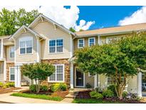 Charming townhome featuring stone accents, manicured landscaping, and inviting curb appeal at 975 Copperstone Ln, Fort Mill, SC 29708