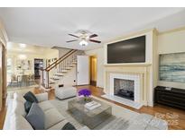 Cozy living room featuring a fireplace, hardwood floors, and natural light at 514 W Sumter St, Shelby, NC 28150