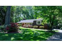 Charming single-Gathering home with lush landscaping and well-maintained lawn at 701 5Th Ne Ave, Conover, NC 28613