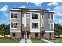 New townhome facade featuring stone accents, gray siding, and modern windows offering great curb appeal at 1116 Bismuth Way, Charlotte, NC 28211