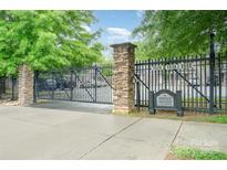 Stone-accented gated entrance to Seigle Heights Condominiums, ensuring privacy and security for residents at 1512 Seigle Ave # 2, Charlotte, NC 28205