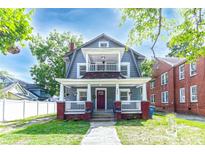 Charming two-story home with a covered porch and a cozy balcony above at 209 W Marsh St, Salisbury, NC 28144