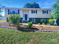 Charming two-story home featuring a landscaped front yard with a walkway leading to the front door at 412 Brook St, Salisbury, NC 28146