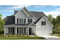 Charming two-story home with a symmetrical facade, a covered porch, and a two-car garage at 149 Glenn Dr, Mooresville, NC 28115