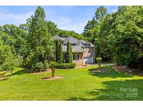 Brick two-story home with mature landscaping and a well-manicured lawn at 7365 Gabriel St, Sherrills Ford, NC 28673