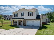 Charming two-story home with a two car garage and a welcoming front porch in a well-manicured lawn at 1925 Maius Dr # 30, Conover, NC 28613