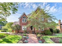 Charming two-story brick home featuring a landscaped front yard and inviting entrance at 4509 Rosecliff Dr, Charlotte, NC 28277