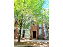 Attractive red brick condo with large windows and mature trees at 226 Magnolia Ave, Charlotte, NC 28203