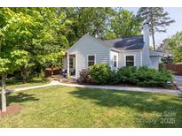 Charming single-story home featuring a landscaped front yard and inviting entrance at 3307 Draper Ave, Charlotte, NC 28205