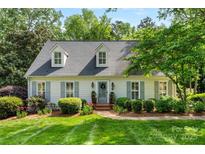 Charming one-story home featuring manicured lawn, dormer windows, and a welcoming entrance at 3424 Clydesdale Dr, Gastonia, NC 28056