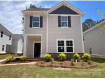 Charming two-story home with stone accents, inviting entry and beautifully landscaped front yard at 4017 Grommet Ct, Matthews, NC 28105