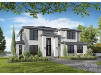 New construction with black framed windows, a black door, and professional landscaping with green grass at 242 Shoreline Loop, Mooresville, NC 28117