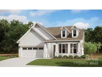 Charming two-story home with white siding, dormer windows, covered porch and attached two-car garage at 5059 Valita Rd, York, SC 29745
