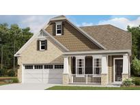 Charming two-story home featuring a combination of brick and siding and a two car garage at 5075 Valita Rd, York, SC 29745