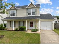 Charming two-story home with front porch and well-manicured lawn at 5312 Peach Place Ln, Charlotte, NC 28216