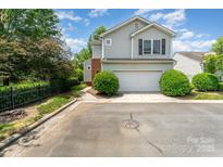 Charming two-story home with a two-car garage and well-manicured landscaping at 8734 Meadowmont View Dr, Charlotte, NC 28269