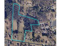 Large parcel of land offering a serene mix of wooded areas and open fields for building at 1040 Nc 90 W Hwy, Taylorsville, NC 20681
