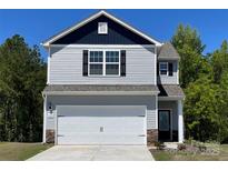 Charming two-story home with a two car garage, light gray siding, and a dark blue accent wall at 1055 Doran Ter, Richburg, SC 29729