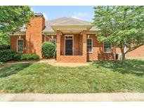 Charming brick home with well-maintained lawn and welcoming front porch at 1141 Ardwyck Pl, Rock Hill, SC 29730