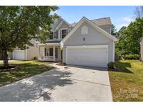 Charming two-story home with a well-maintained lawn and an attached two-car garage at 4729 Nijinsky Ct, Charlotte, NC 28216