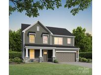 Charming two-story home with a welcoming front porch and attached two-car garage at 5112 Izzo Ln, Charlotte, NC 28214