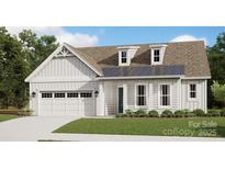 Charming home with white siding, dormer windows, and manicured front lawn and covered entryway at 7017 Treetop Ct, York, SC 29745