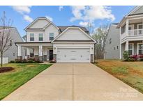 Charming two-story home with a spacious two-car garage and inviting curb appeal with a long driveway at 154 Cotton Field Dr, Statesville, NC 28677