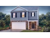 Charming two-story home featuring stone accents, gray siding, and a well-maintained front yard at 222 Giant Oak Ave, Statesville, NC 28677