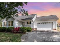 Charming single-story home boasts a two-car garage, well-maintained landscaping, and inviting curb appeal at 4751 Kemp Dellinger Rd, Maiden, NC 28650