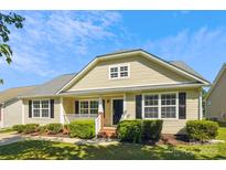 Charming home with a welcoming front porch, manicured landscaping, and classic black shutters at 5018 Drake Pond Ln, Rock Hill, SC 29732