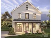 Charming two-story modern farmhouse with inviting front porch and beautiful landscaping at 1427 Rankin Ave, Gastonia, NC 28052