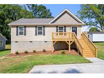 Charming single-story home featuring a lovely wooden deck and appealing curb appeal at 953 Hardin Dr, Shelby, NC 28150