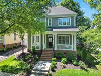 Charming two-story home with landscaped front yard and inviting porch at 1855 Second Baxter Xing, Fort Mill, SC 29708