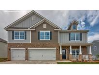 Inviting two-story home featuring a brick facade and a two-car garage at 217 Giant Oak Ave, Statesville, NC 28677